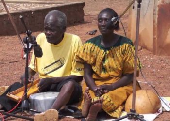 Kilipa Ogwang plays the nanga with wife as co-performer.