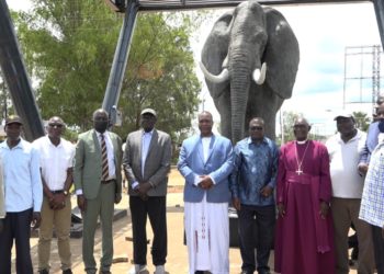 Lawirwodi David Onen Acana II with Acholi leaders pose at the elephant monument at Layibi traffic circle in Gulu City.