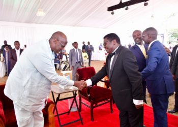 The President's brother, Gen Salim Saleh,(left) meets DP President Norbert Mao at Mao's homecoming at Kaunda Grounds in Gulu City on July 22, 2023.